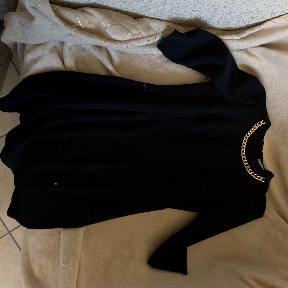 Black dress gold chain neck detail